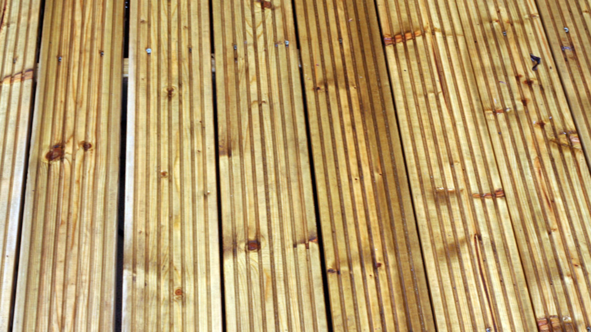 Newly laid golden timber decking boards ready for a Christchurch deck